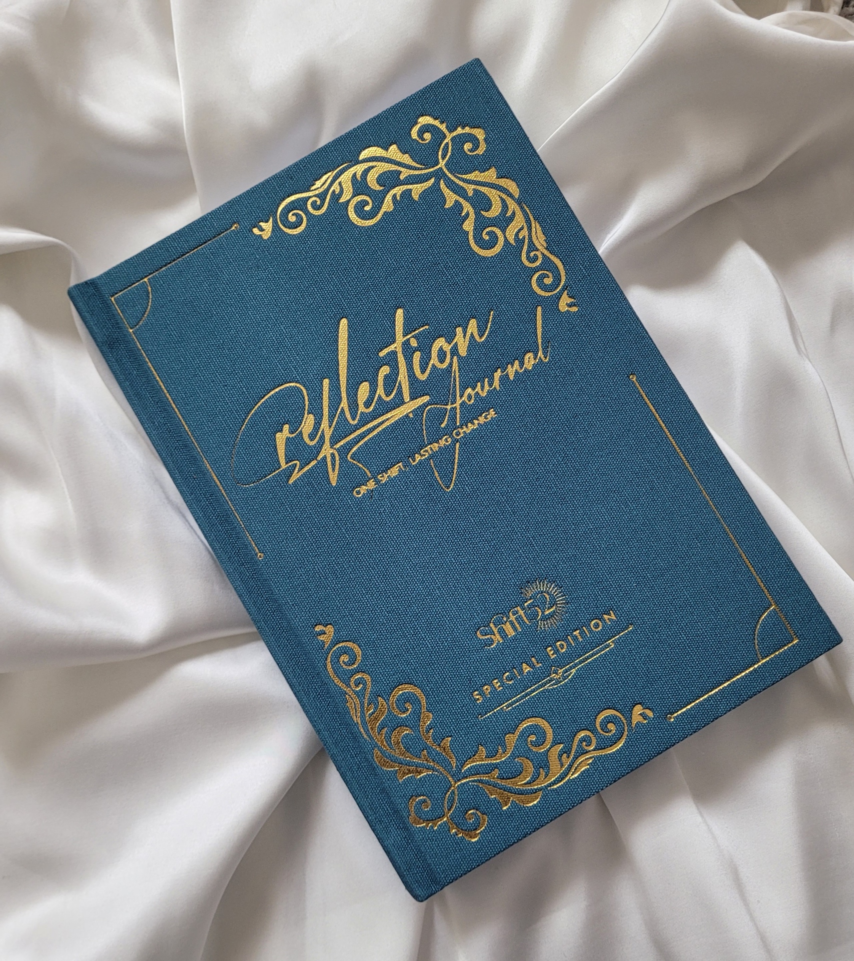 A linen reflection card resting on folded cloth